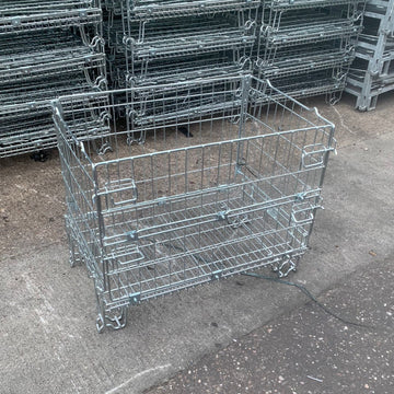 Used collapsible wire mesh pallet cage, featuring a half drop gate.